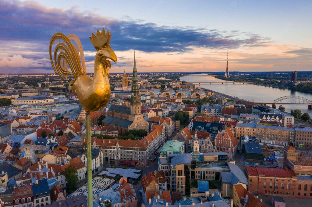 Stunning Golden Rooster View Over Riga's Historic Cityscape Wallpaper