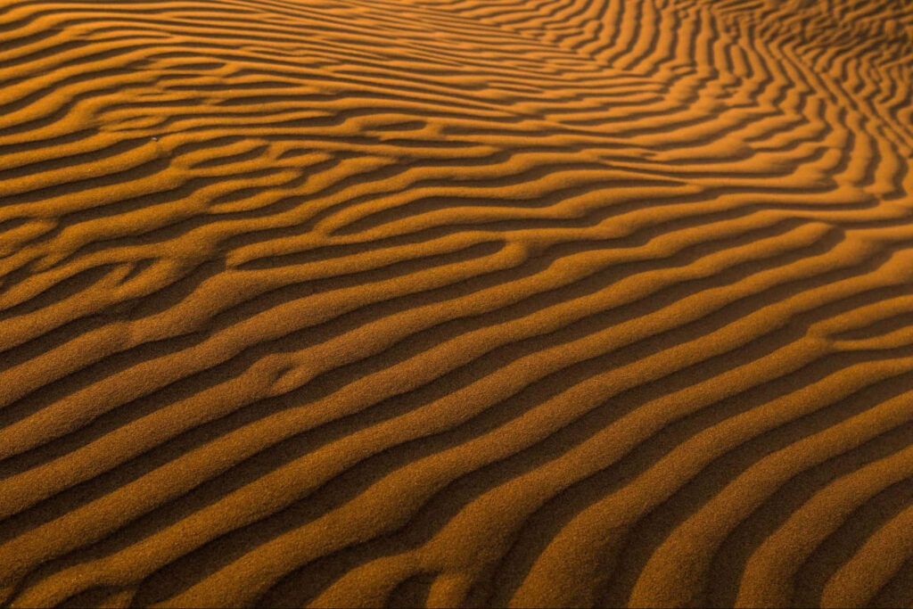 Mesmerizing Golden Sand Dunes Wallpaper Background