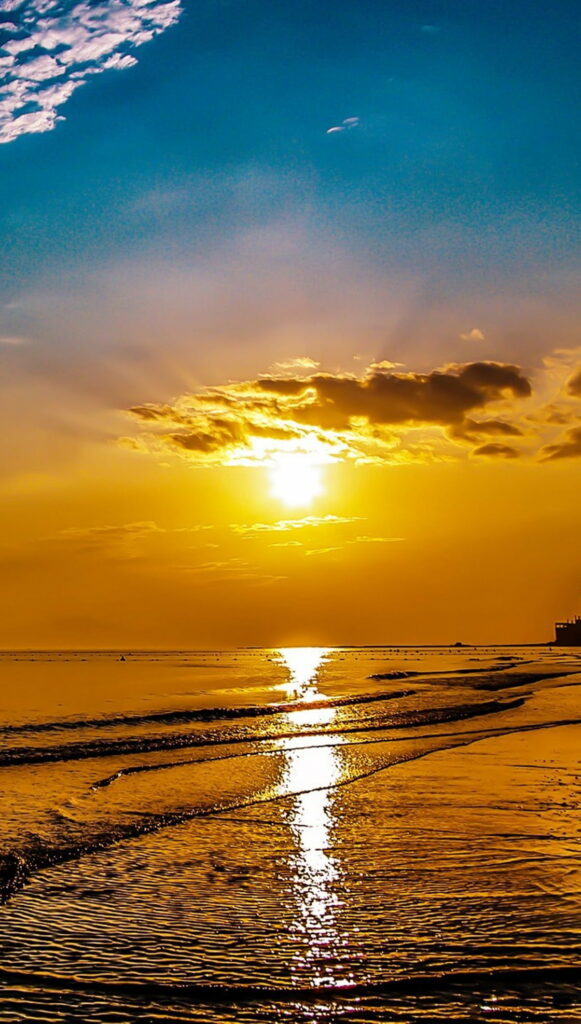 Glorious Gold Glimmers: Captivating Beach Sunrise Painting the Sky in Nature's HD Phone Wallpaper