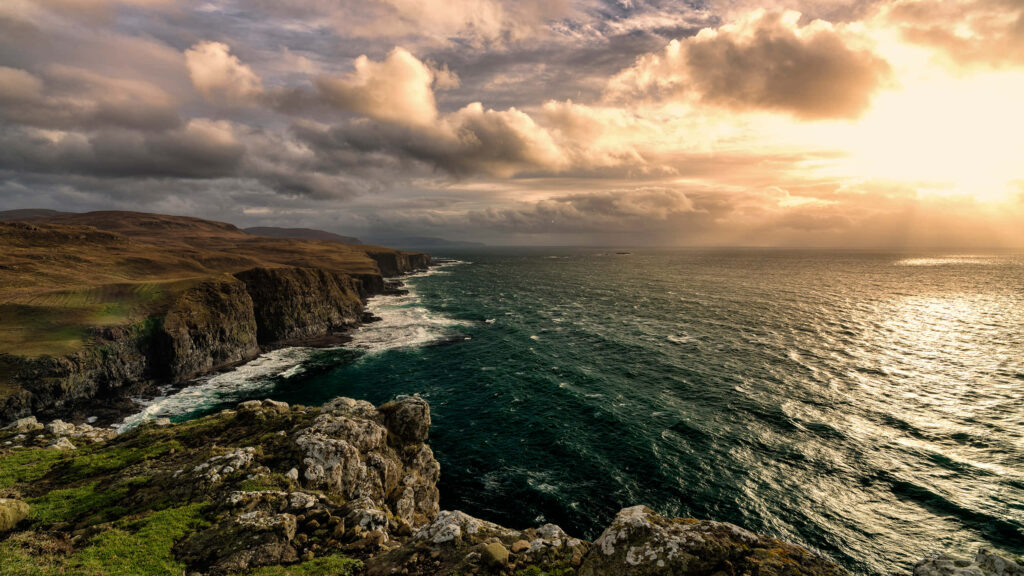 Cliff Coast Sunset Wallpaper: Breathtaking Ocean View in Golden Light