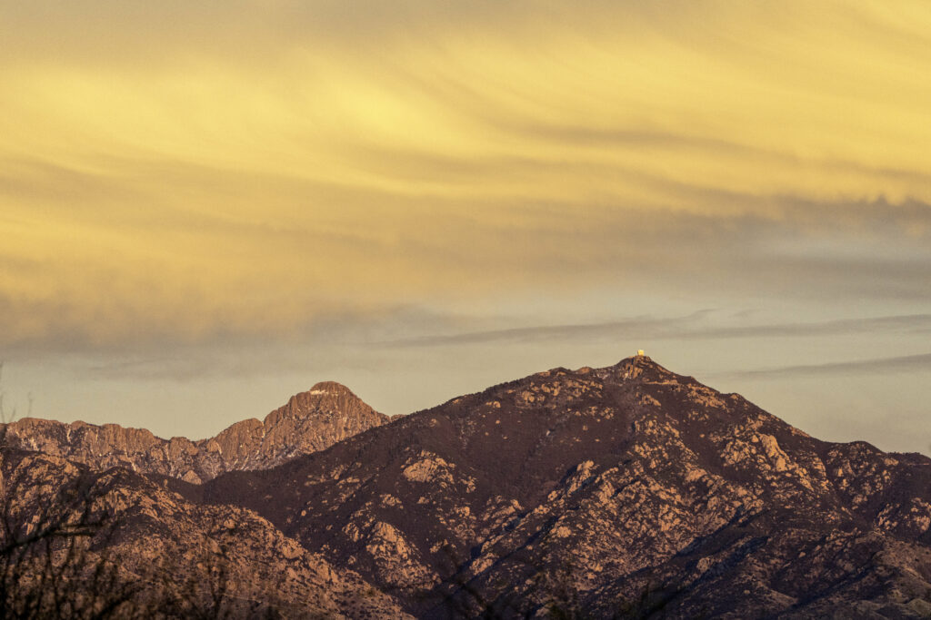 Breathtaking mountain landscape at sunset with golden peaks and vibrant colorful sky wallpaper