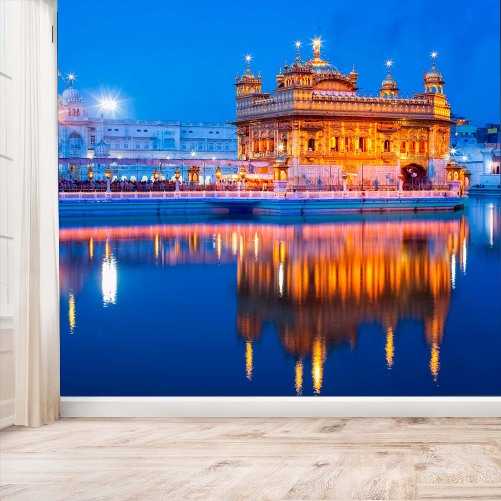 Golden Temple wall mural at twilight glowing gold against blue sky reflecting in water interior decor Wallpaper