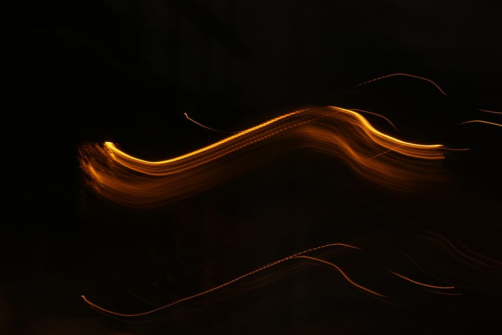Dynamic Golden Wavy Lines Wallpaper on Dark Background - 5184x3456