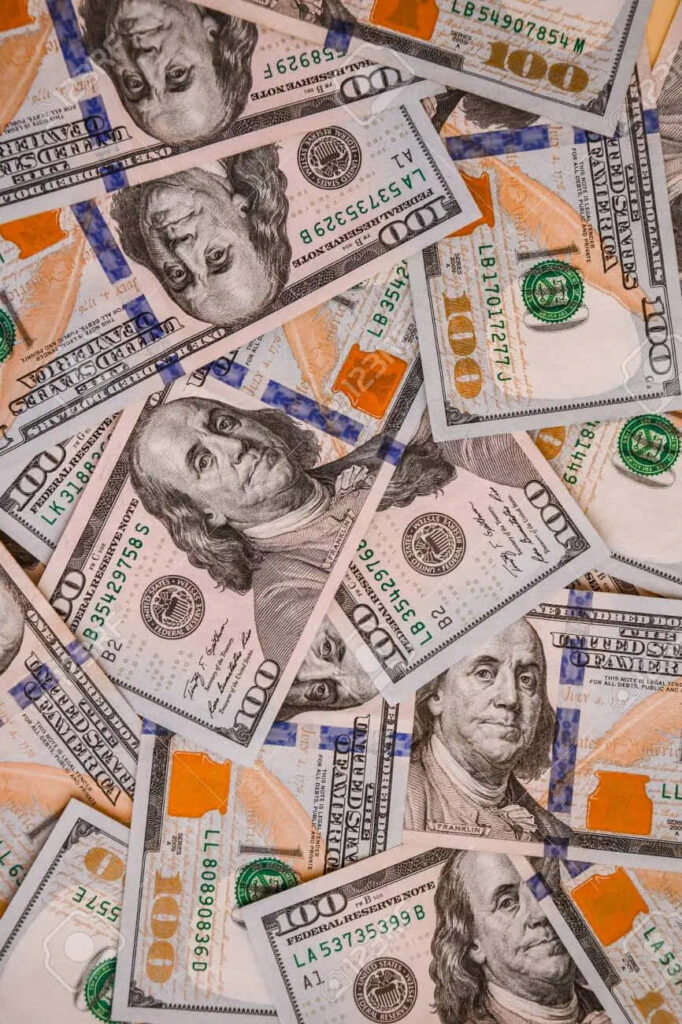 Vibrant Wealth: A Striking 100-Dollar Bill Pile as your Phone's Breathtaking Background Wallpaper
