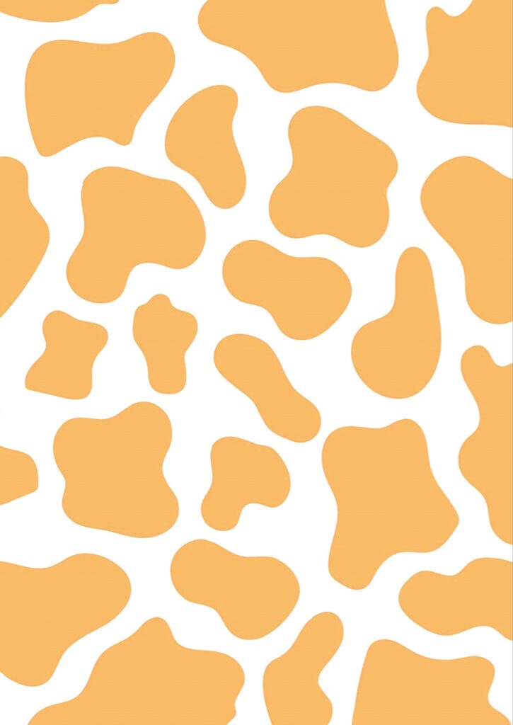 Cow print wallpaper with irregular golden yellow spots on white background playful modern design