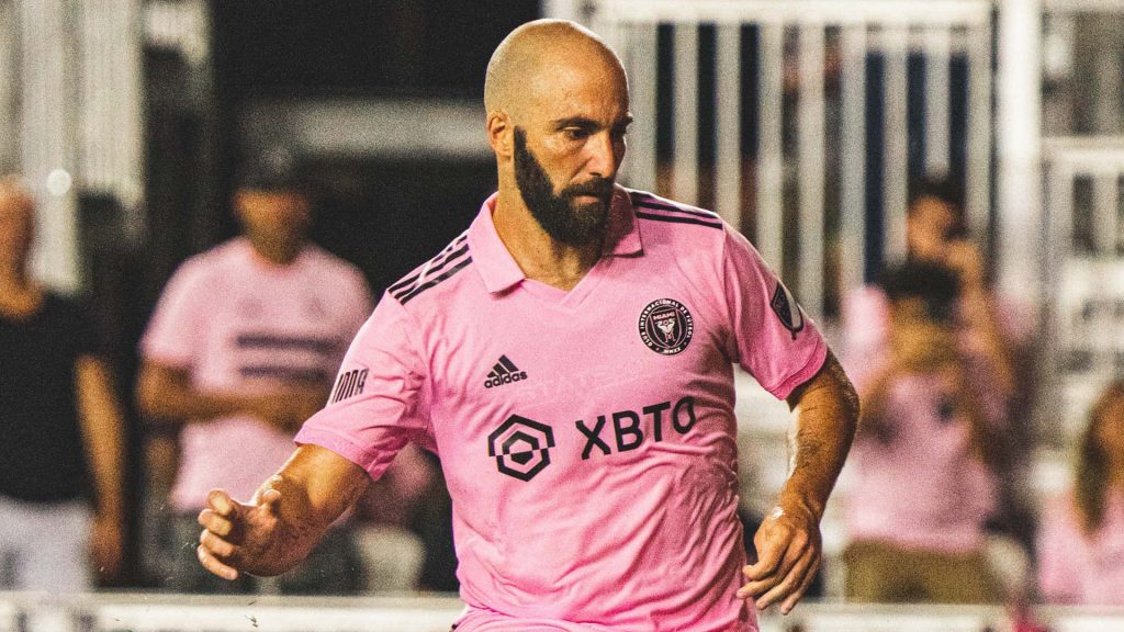 Gonzalo Higuain Inter Miami CF in pink kit focused during intense soccer match wallpaper