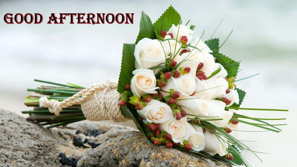 Good Afternoon bouquet of fresh white roses and red berries wrapped in rustic cream rope outdoors Wallpaper