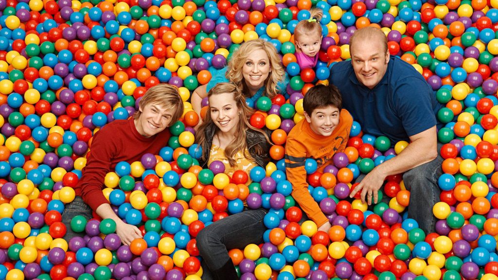 Good Luck Charlie cast in colorful ball pit vibrant family wallpaper with Bridgit Mendler and Duncan family