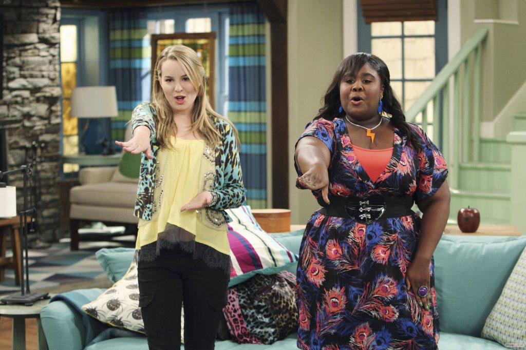 Good Luck Charlie wallpaper Bridgit Mendler and Raven Goodwin vibrant living room scene