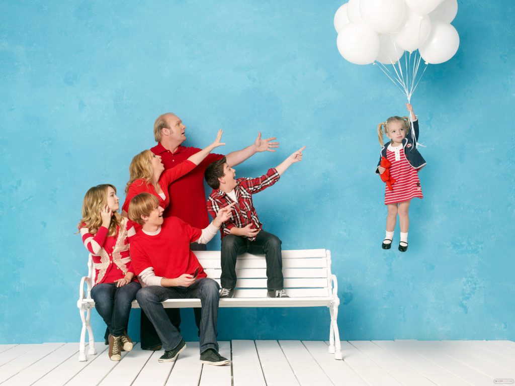 Good Luck Charlie wallpaper showing Duncan family with baby Charlie floating on balloons