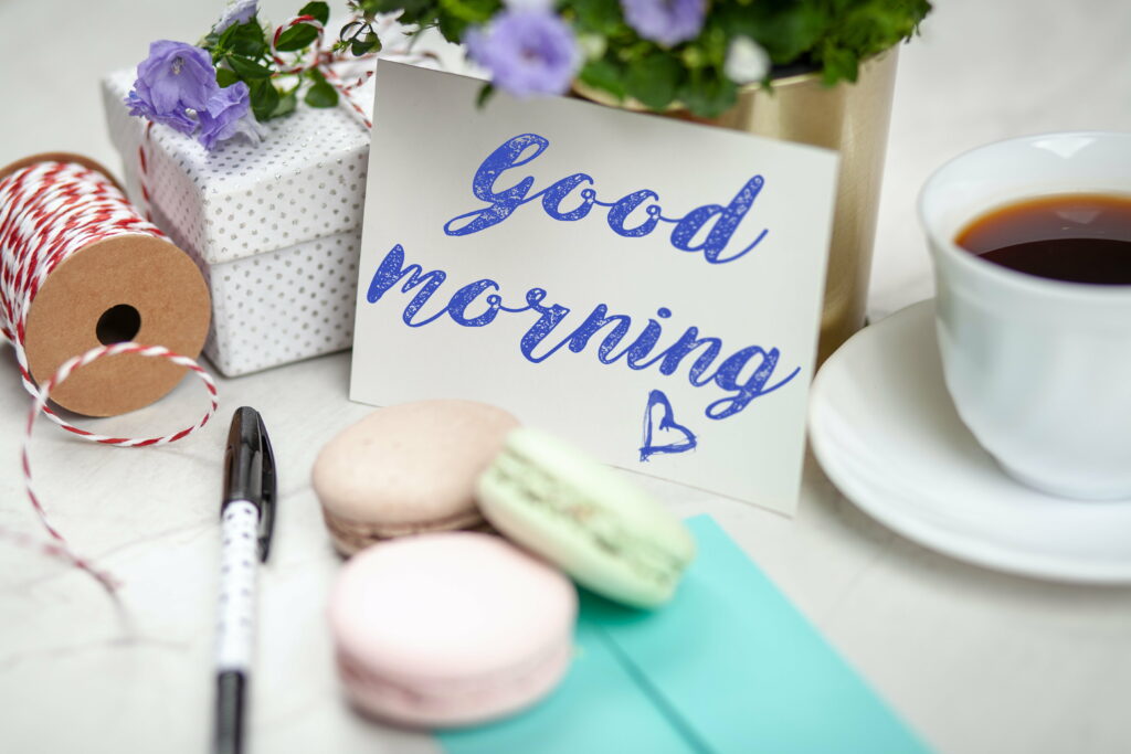 Refreshing Start: A Delightful Morning Greeting Card with Abstract Goodness, White Flowers, and a Gift of Delicious Food Wallpaper