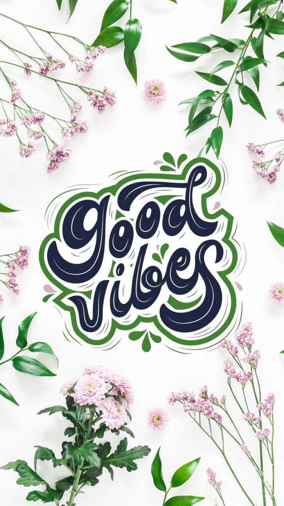 Good Vibes calligraphy art wallpaper with navy and green text pink flowers lush leaves white background