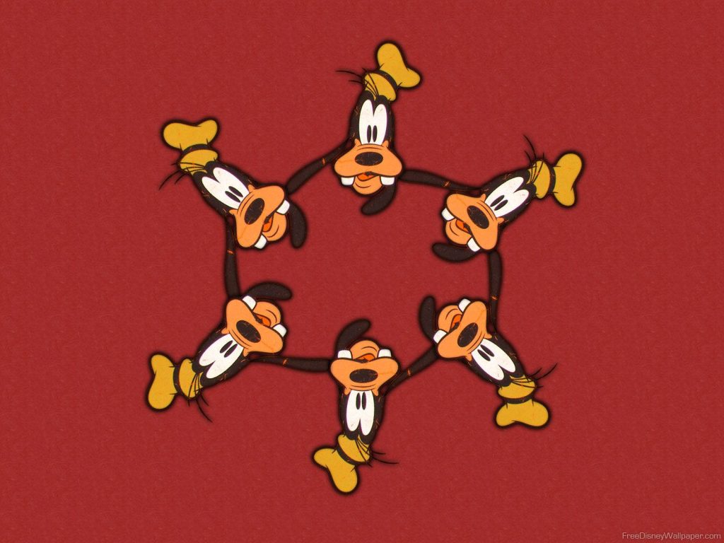 Playful symmetrical wallpaper with six cartoon Goofy heads in a vibrant red circle background