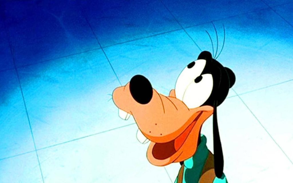 Goofy Disney wallpaper featuring joyful character looking up on bright blue tiled background