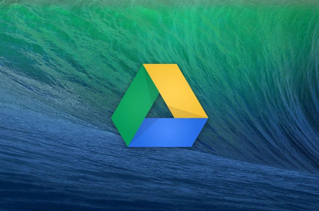 Google Drive logo centered on macOS Mavericks green blue ocean wave wallpaper background