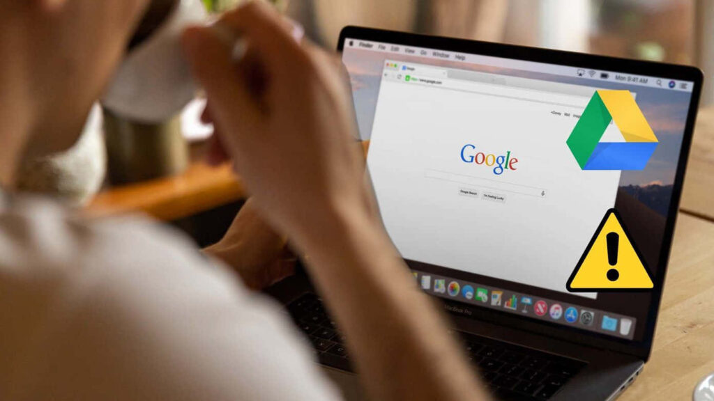 Google Drive Warning: Laptop User with Google Homepage Wallpaper