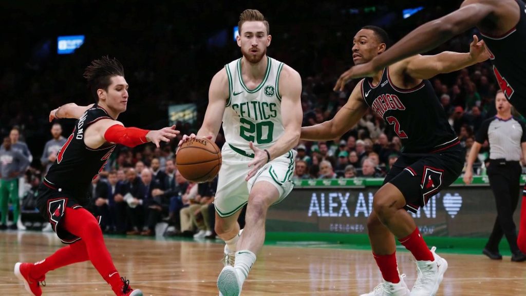 Gordon Hayward Celtics vs Chicago Bulls NBA action dribbling past defenders on basketball court Wallpaper