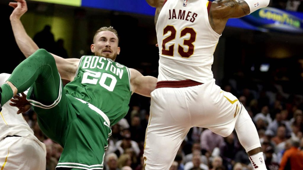 Boston Celtics Gordon Hayward falling with LeBron James in 2017 NBA season opener action wallpaper