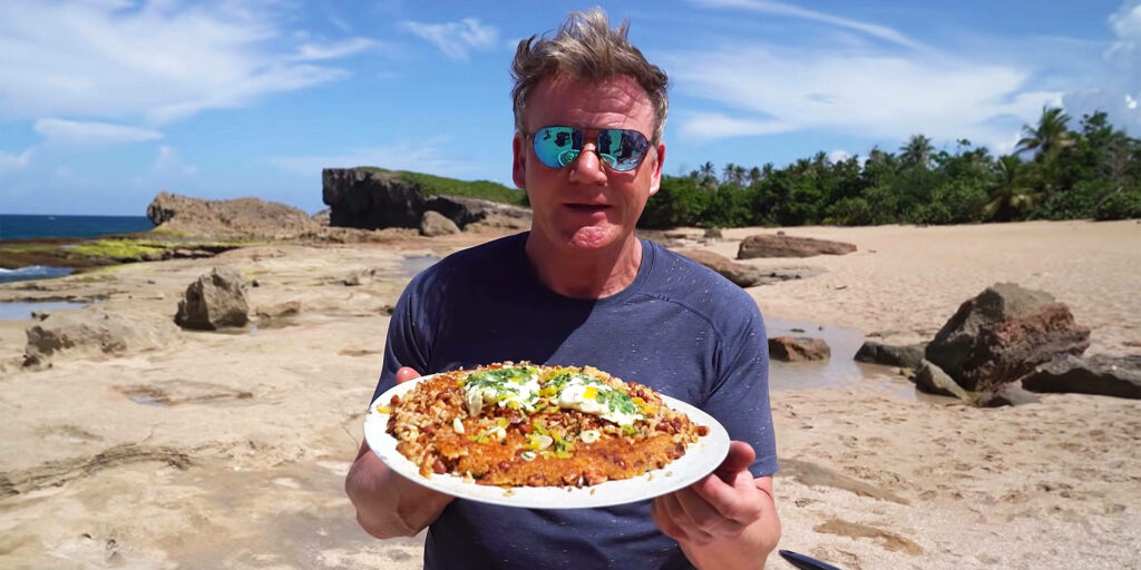Gordon Ramsay Enjoys Puerto Rican Cuisine on Tropical Beach Wallpaper