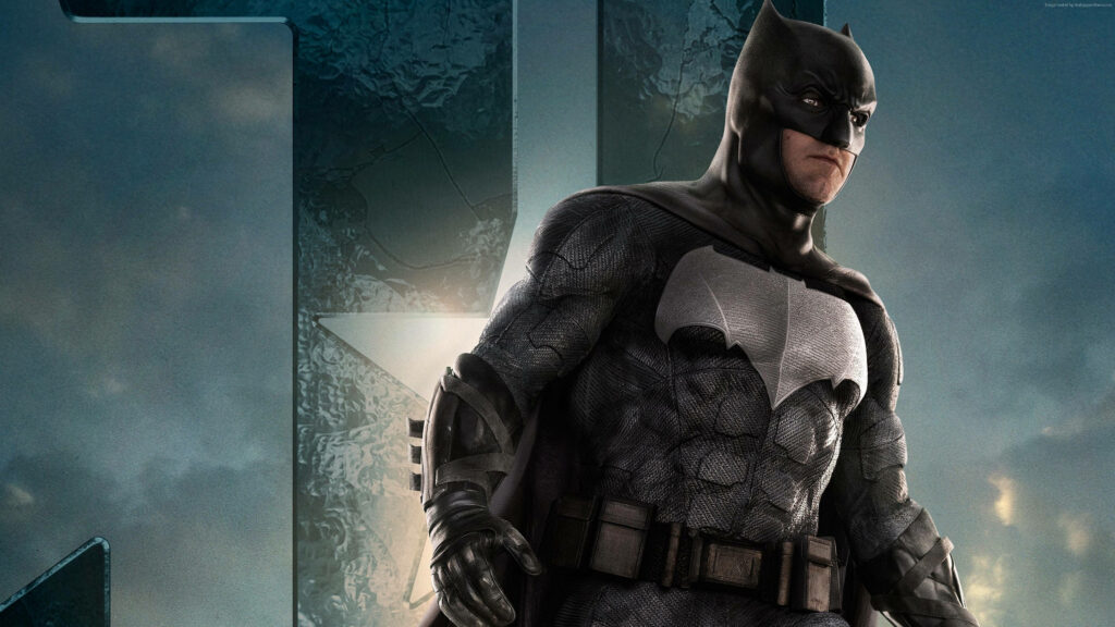 The Dark Knight Rises: 4k Wallpaper Showcasing Batman's Legendary Batsuit with the Iconic Scalloped Cape and Emblematic Bat-like Cowl