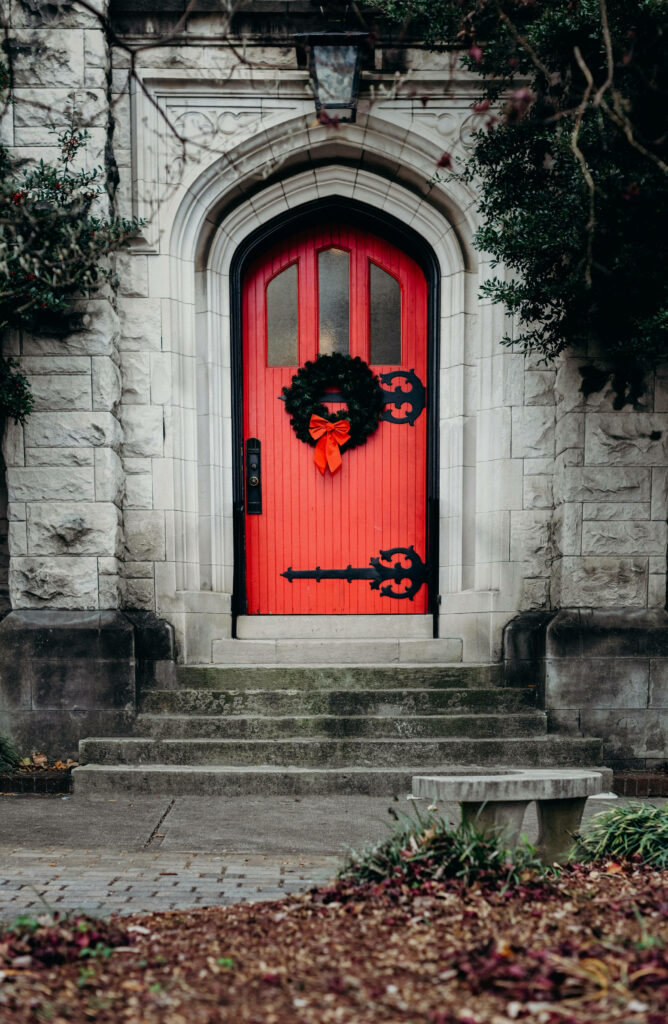 Gothic Stone Archway with Festive Red Door - Unique Holiday Decor Wallpaper