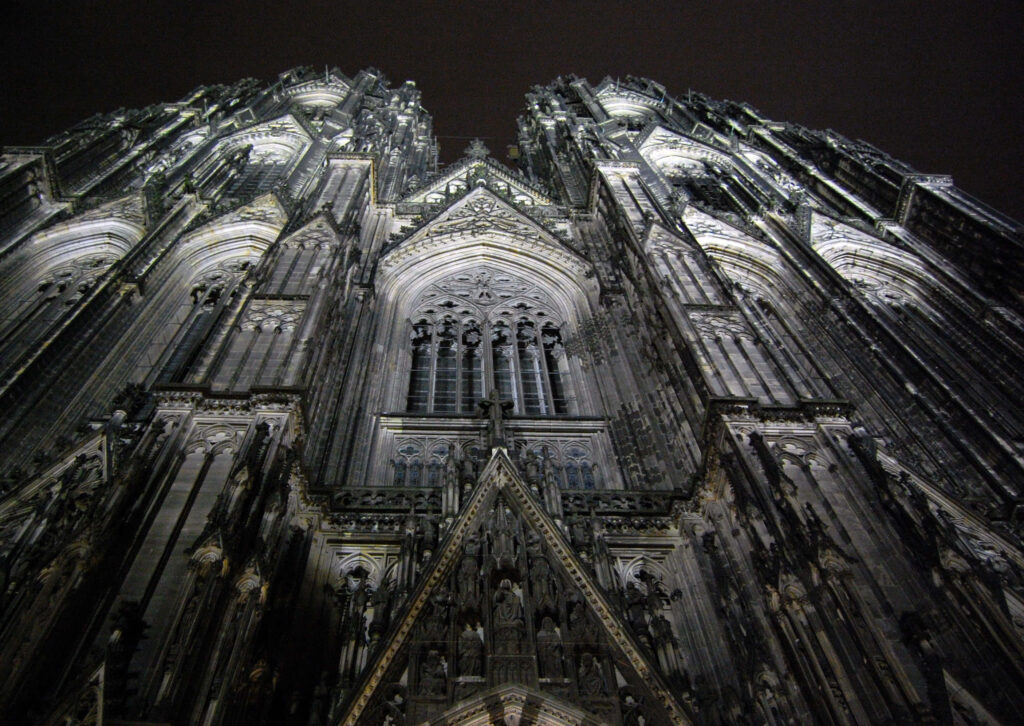 Dramatic Gothic Cathedral Wallpaper: Nighttime Architectural Elegance