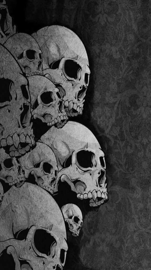 Gothic Skull Wallpaper: Intricate Design on Dark Ornate Background