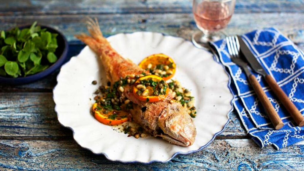 Stunning Gourmet Fried Red Mullet with Orange Garnish - Wallpaper