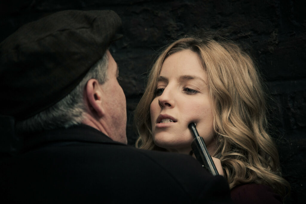 Gritty Standoff: Grace Burgess Confronts Danger in Stunning Peaky Blinders 8k Background Wallpaper