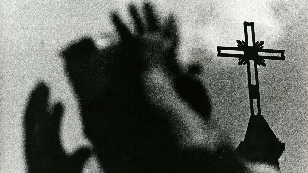 Into the Light: A Striking Grayscale Christian Cross Wallpaper