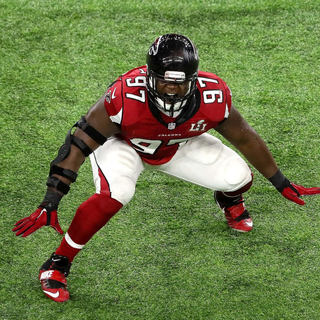 Grady Jarrett: Atlanta Falcons Star in Dynamic Red Uniform Wallpaper