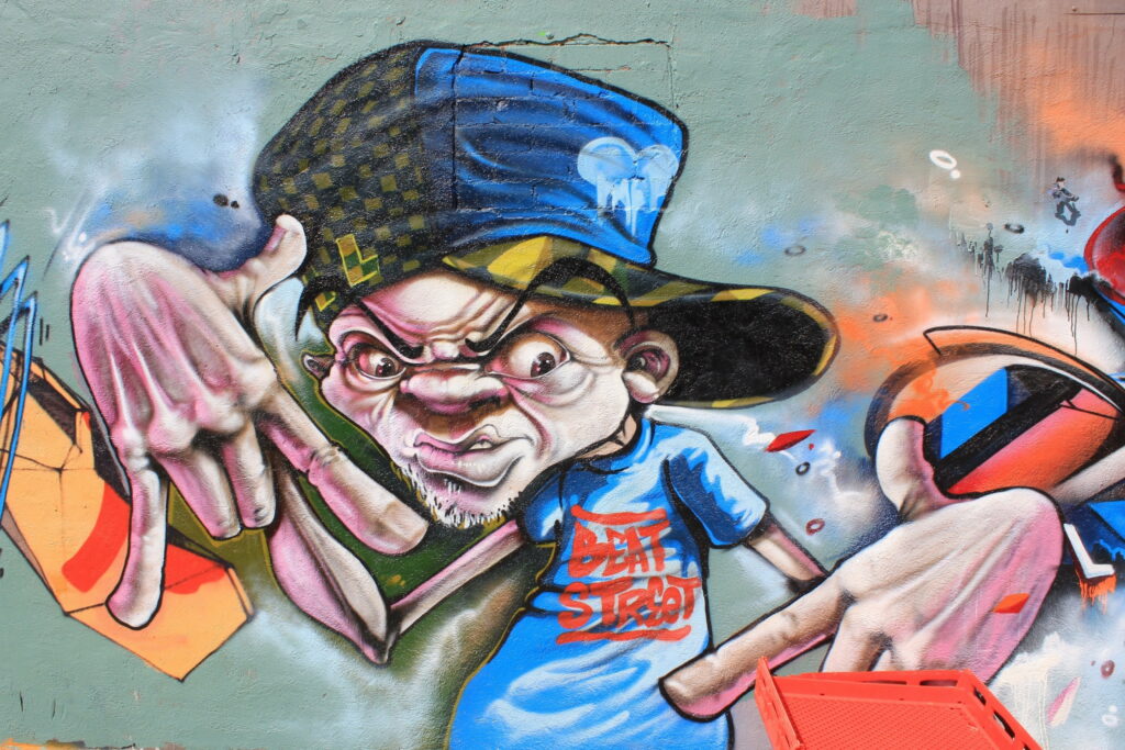 Urban Canvas: The Vibrant Abstract Graffiti Wall - A High-Definition HD Wallpaper Background