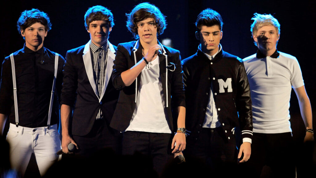 Captivating One Direction: Grammy-Nominated Pop Icons Win Over the World with Charismatic Stage Performance Wallpaper