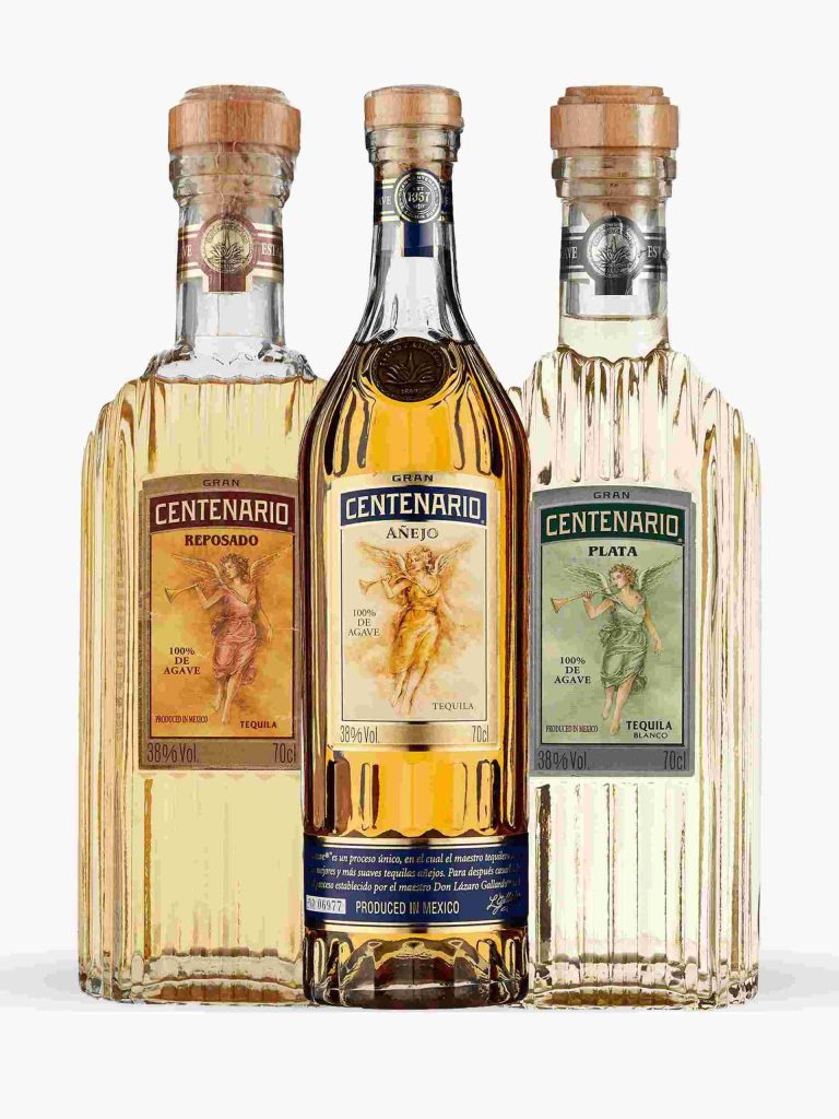 Gran Centenario Tequila Reposado Añejo and Plata bottles with angel labels on bright background Wallpaper