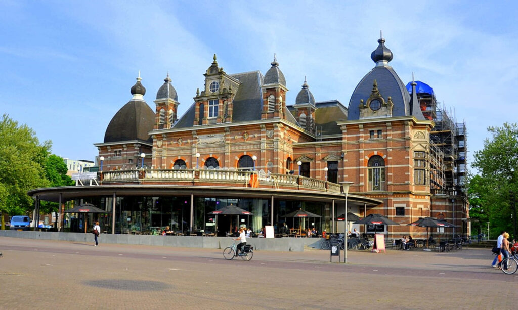 Grand historical Arnhem building under renovation with classic architecture and modern restoration Wallpaper