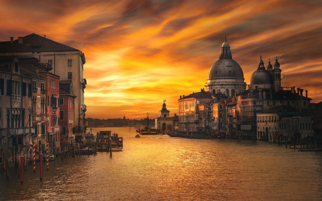 Golden Reflections: A Stunning Sunrise over Venice's Grand Canal and Lagoon from Ponte del'Accademia - 4K Wallpapers for Desktop or Mobile