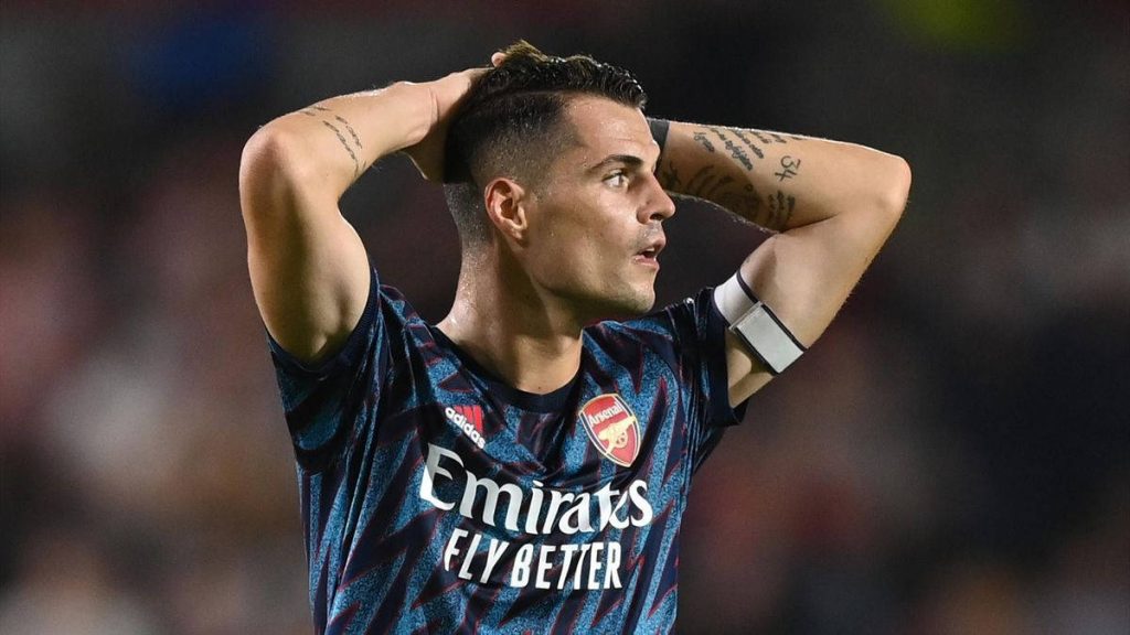 Granit Xhaka Arsenal midfielder intense focus in dark blue kit high-resolution football wallpaper