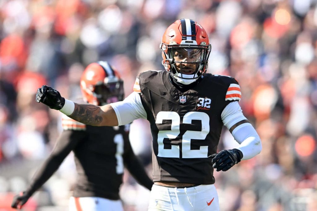 Grant Delpit Cleveland Browns number 22 celebrating intense NFL gameplay action wallpaper
