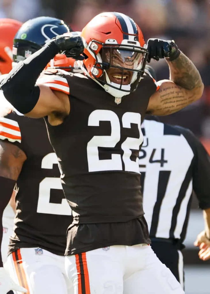 Cleveland Browns safety Grant Delpit celebrating in brown jersey number 22 NFL football action wallpaper