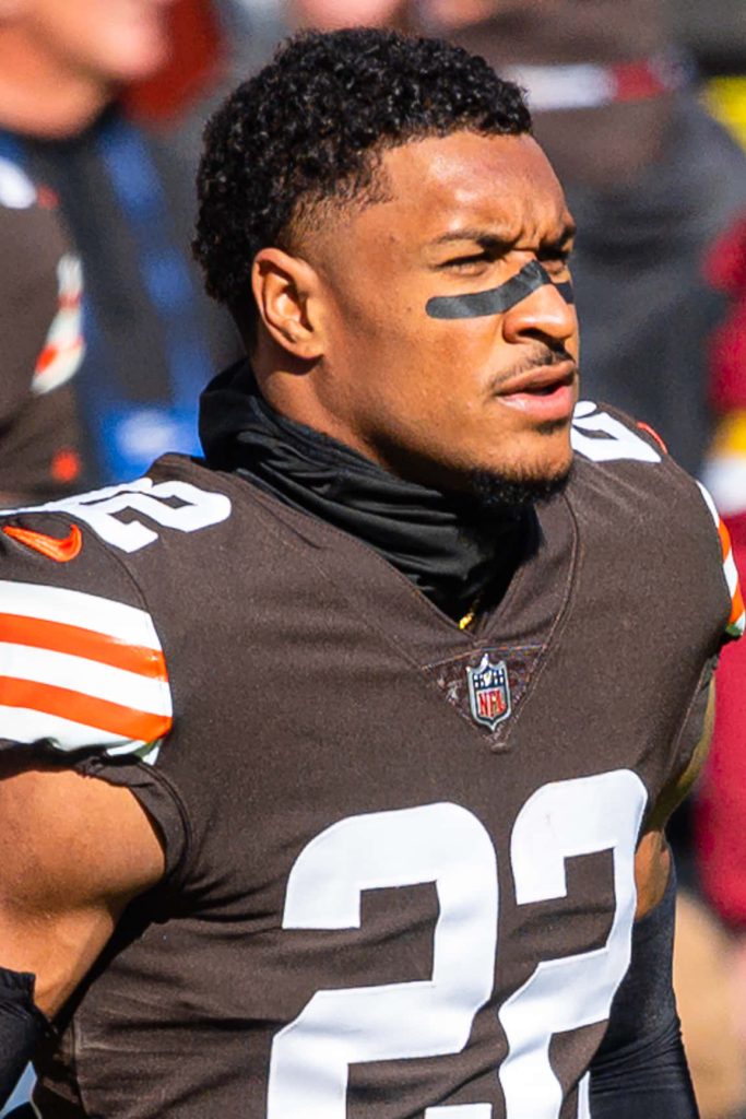 NFL safety Grant Delpit in Cleveland Browns uniform number 22 focused in game action portrait Wallpaper