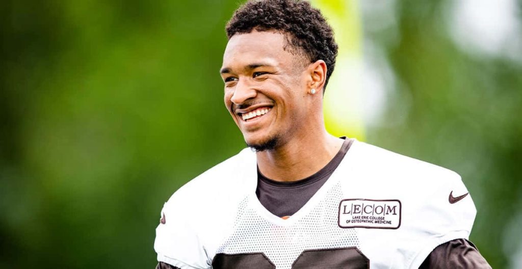 Grant Delpit Cleveland Browns safety smiling in practice white jersey LECOM green background wallpaper