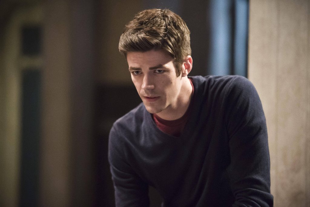 Grant Gustin as Barry Allen intense expression soft lighting blurred indoor background wallpaper