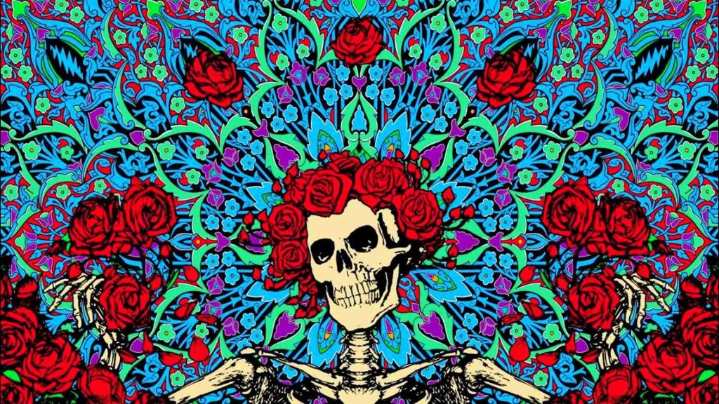 Psychedelic Grateful Dead Skull and Roses wallpaper with neon blue green purple kaleidoscope pattern