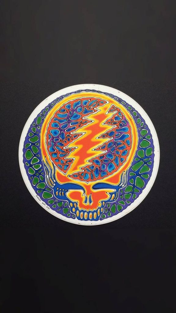 Grateful Dead Steal Your Face wallpaper vibrant orange lightning bolt blue green skull design