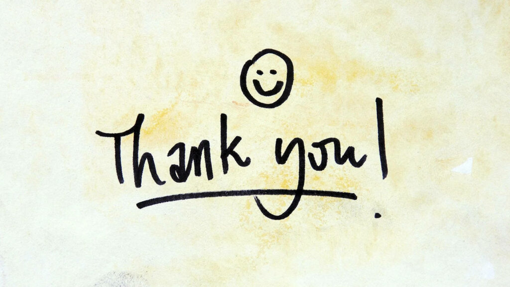 Beaming with Gratitude: Thank You Smiley Wallpaper Background