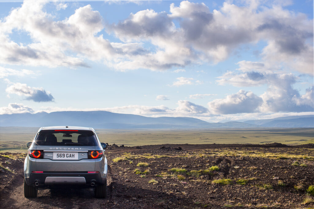 Gray Land Rover Discovery SUV in Scenic Landscape - Adventure Wallpaper