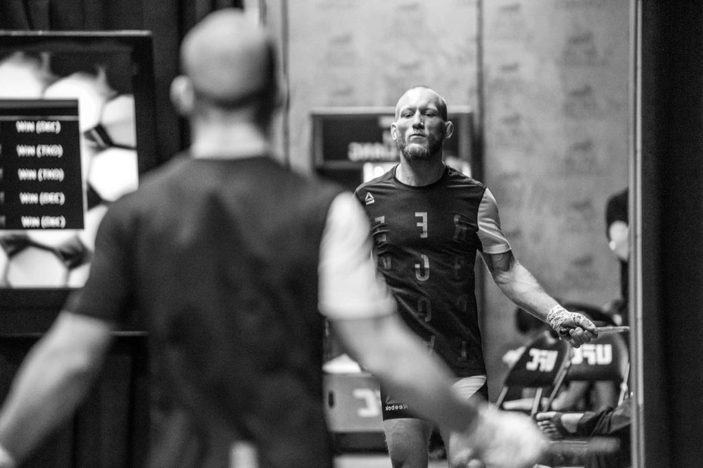 UFC fighter Gray Maynard intense gym training reflection black and white high contrast MMA Wallpaper