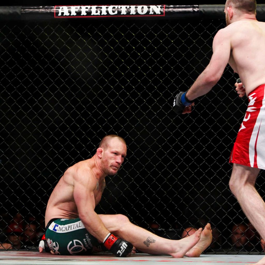 Gray Maynard MMA fight in Octagon cage intense UFC action high-resolution wallpaper background