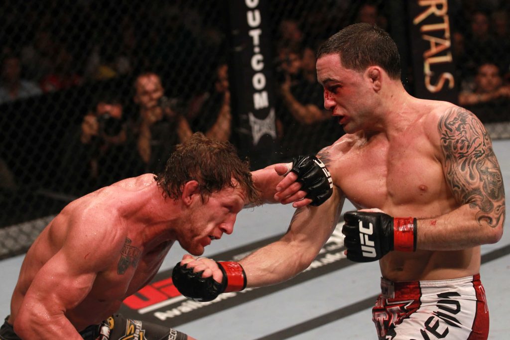 Gray Maynard and Frankie Edgar intense UFC Octagon fight wallpaper showcasing MMA action