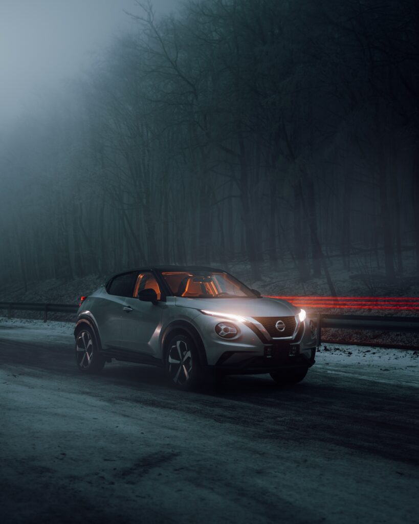 Gray Nissan Juke in Fog: Dramatic Side View Wallpaper